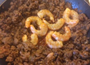 Add Shrimp to the center of the Chorizo 